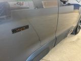 a close up of a car door with a sticker on it