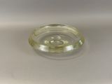 a clear glass bowl with a small amount of liquid in it
