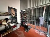 an image of a room with a lot of clothes on the shelves