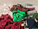 a pile of clothing that is sitting on a table