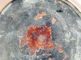 a close up of a plate with a red substance on it