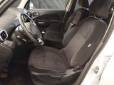 the interior of a car with a steering wheel and seat covers