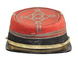 a red hat with a black band and a gold band