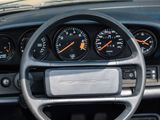 a steering wheel and gauges in the dashboard of a car