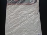 a mattress that is sitting on a table in a room