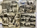 several black and white photos of a bunch of old postcards