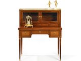 an image of a desk with a clock on top of it