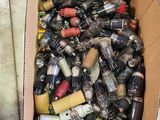 a cardboard box filled with assorted items on the floor