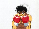 une photo d'un jeune homme portant des gants de boxe et prenant la pose