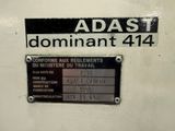 a sign on the side of a machine that says adast dominant 414