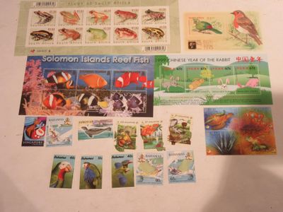a collection of stamps and postcards on a table