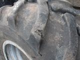 a large tire that is sitting on the side of a truck