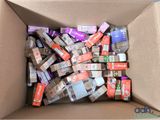 a cardboard box filled with many different types of electronic devices