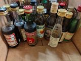 many bottles of alcohol sitting in a cardboard box