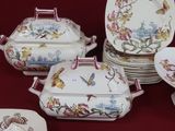 many plates and bowls that are sitting on a table