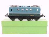 a toy train sitting on top of a green box