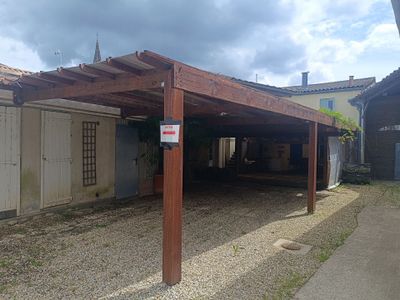 a wooden structure with a sign on the side of it