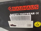 a box of safety footwear that is sitting on a table