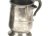 a silver cup with a handle on a white background