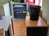 an image of a small room with a desk and a chair