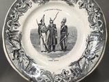 two black and white plates with a picture of a man and a woman on them