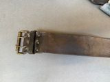 a belt that has a buckle on it on a table
