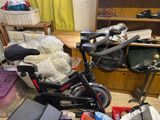 a bike that is sitting in a cluttered room
