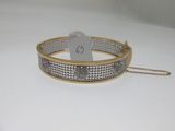 a close up of a bracelet with a tag on it