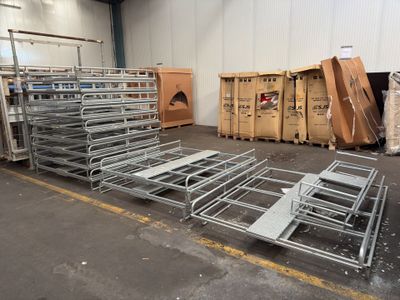 a lot of metal racks and boxes in a warehouse