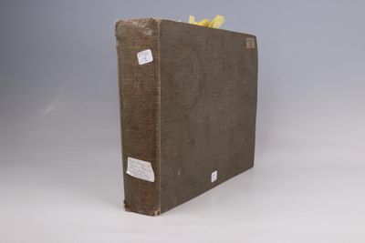 a brown book with a yellow ribbon on it