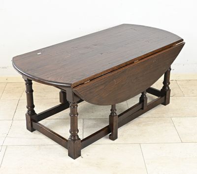 a small table with a wooden top on a tile floor