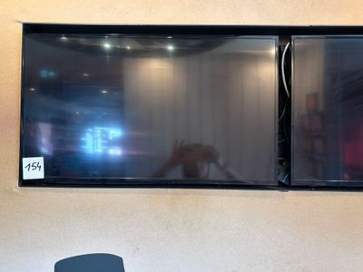 two televisions on the wall in the room