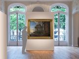 a statue that is standing in front of a painting