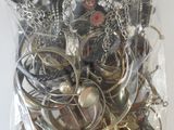 a bag of assorted silver and gold jewelry