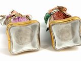 pair of porcelain figurines of a woman and a man in a box