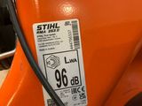an orange motorcycle with a sticker on the side of it