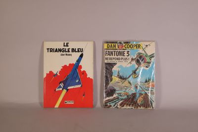 two books sitting on a table next to each other on a white surface