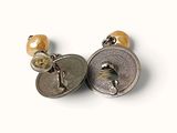 a picture of a pair of earrings that are on a white surface