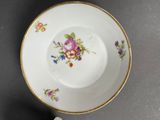a white plate with a floral design on it