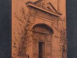 an old photo of a building with a door and a clock on it