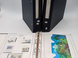a black binder with a picture of a map inside of it