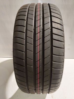 a close up of a tire on a white surface