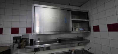 an image of a kitchen with a sink and a mirror