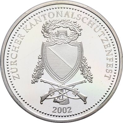 une image représentant une pièce d'argent sur laquelle figure un blason
