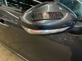 an image of a car door handle with a sticker on it