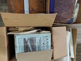 many boxes of books stacked on top of each other