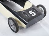 a black and white toy car with a number 5 on it