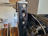 an image of a machine that has a bunch of reels on it