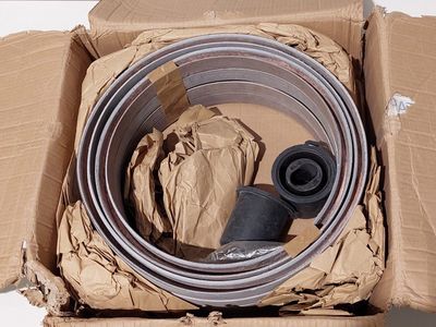 a cardboard box with a couple of hoses inside of it