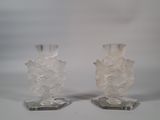 two clear vases sitting on top of each other